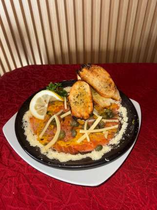 Carpaccio de Salmón - Restaurante en Secretos a Bordo - Recoleta, Santiago